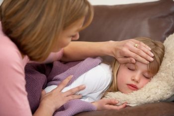 Mother Taking Temperature Of Sick Daughter