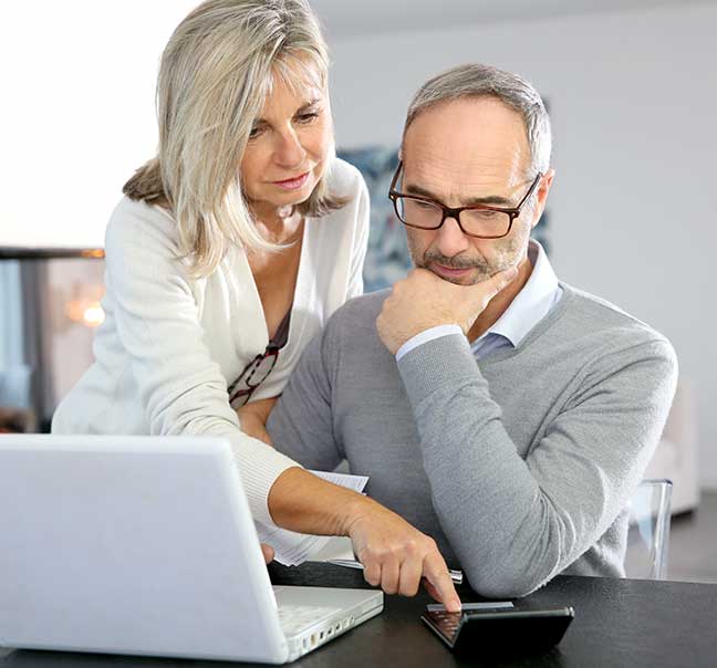 Couple looking at iPad - The Right Coverage for you - Your Insurance Gal
