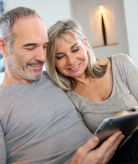 Couple looking at iPad - What is Piece of mind worth - Your Insurance Gal