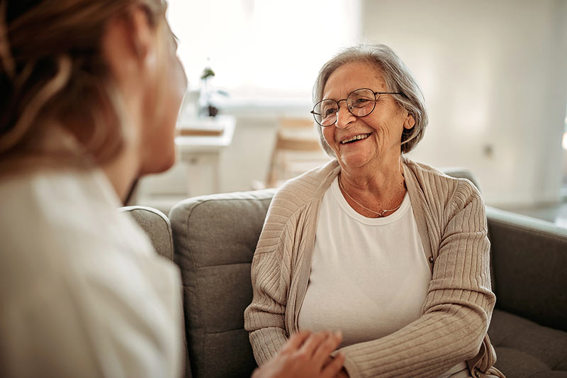 Woman explaining to senior how medicare benefits you
