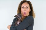 Woman with her puppy Medicare Advantage Plan Your Insurance Gal